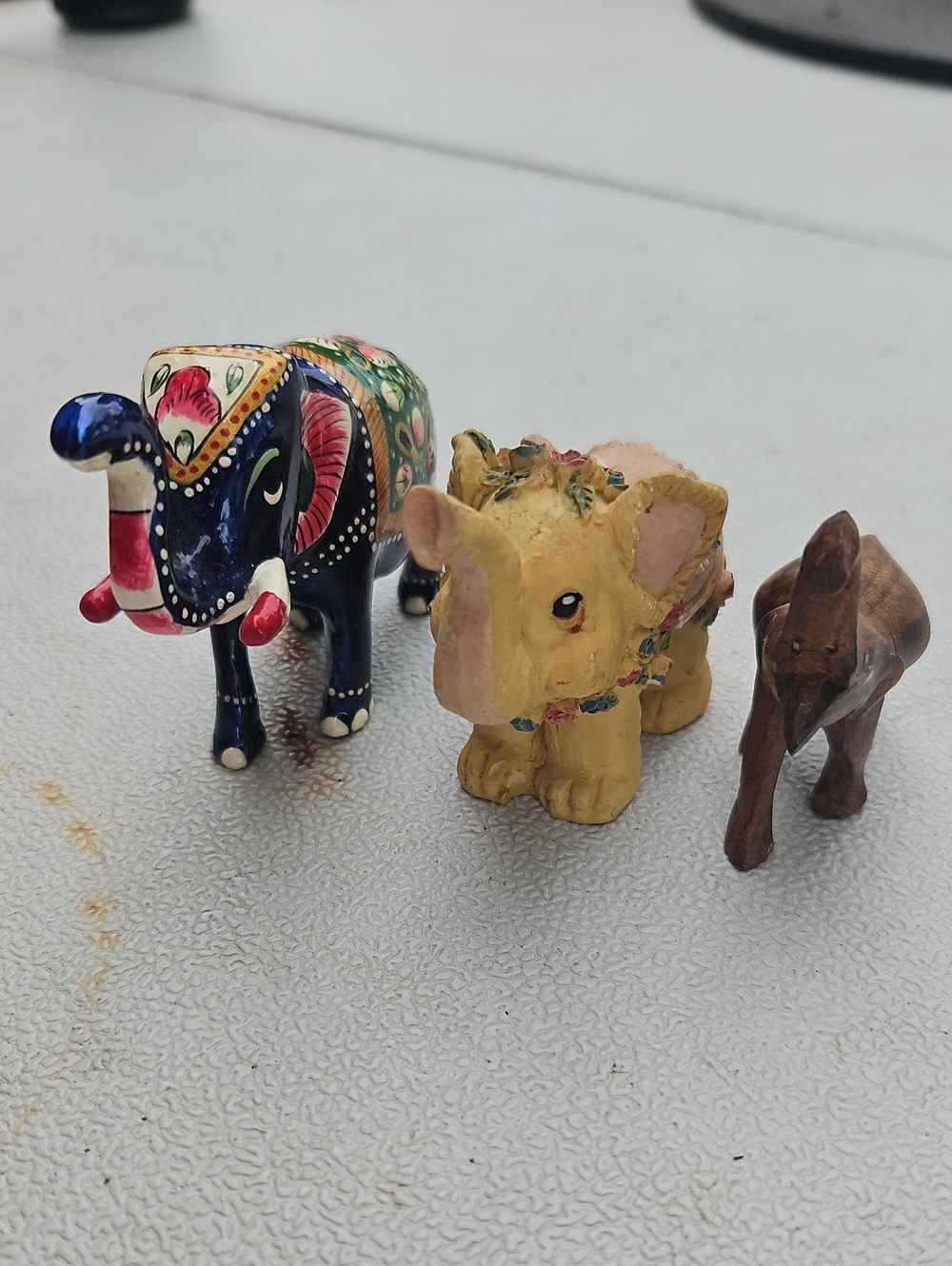 Vintage Hand-Painted Elephant Trio in Blue, Yellow, and Brown